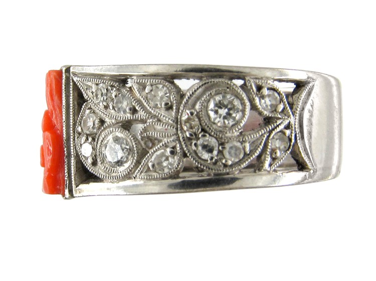 Carved Coral Ring with Diamond Sides Set in Platinum