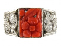 Carved Coral Ring with Diamond Sides Set in Platinum