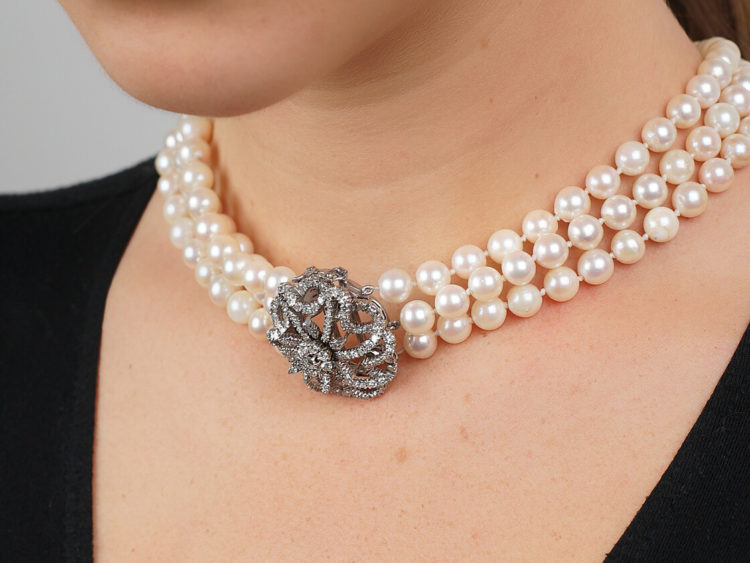 Cultured Pearl Three Strand Necklace with Large Diamond Set Flower Clasp