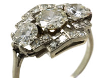 Art Deco Platinum & Three Stone Diamond Ring Within a Geometric Setting