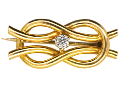 Edwardian 15ct Gold Lover’s Knot Brooch Set With a Diamond