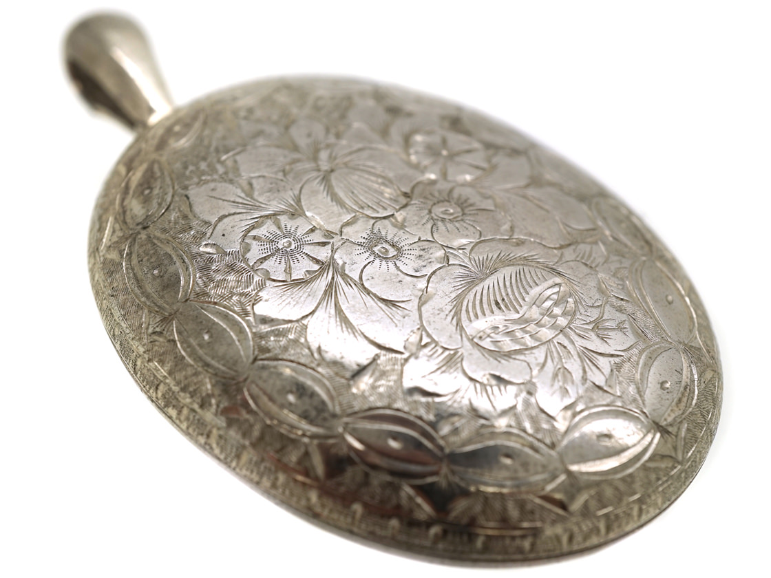 Victorian Large Silver Oval Locket With Flower Engraved Decoration Victorian Large Silver Oval Locket With Flower Engraved Decoration