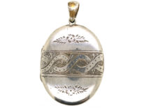 Victorian Oval Silver Locket With Entwined Ribbon Design