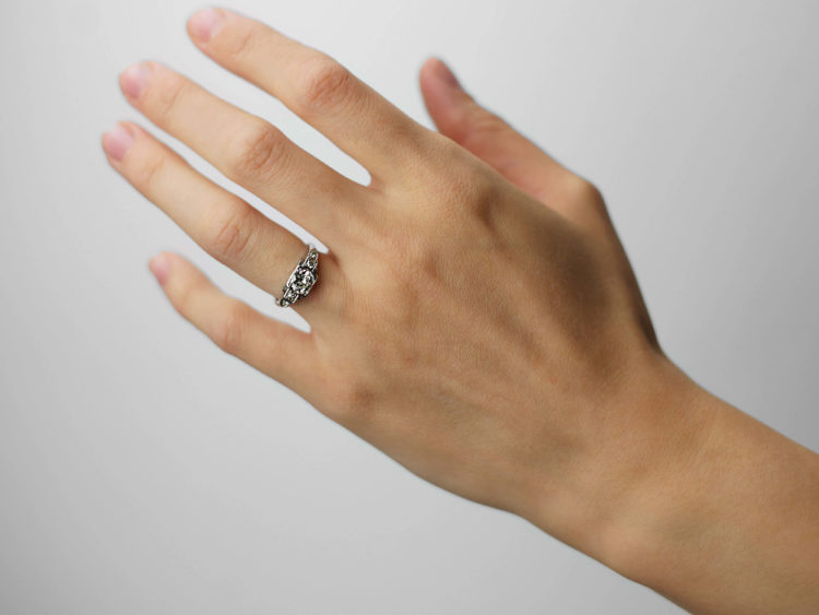 Art Deco Platinum Diamond Solitaire Ring with Step Cut Diamond Set Shoulders