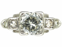 Art Deco Platinum Diamond Solitaire Ring with Step Cut Diamond Set Shoulders