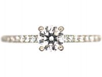 Platinum & Diamond Solitaire Ring with Diamond Set Shoulders by De Beers