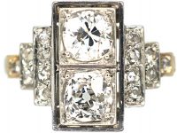 Art Deco Platinum, Two Stone Diamond Ring with Step Cut Shoulders set with Diamonds