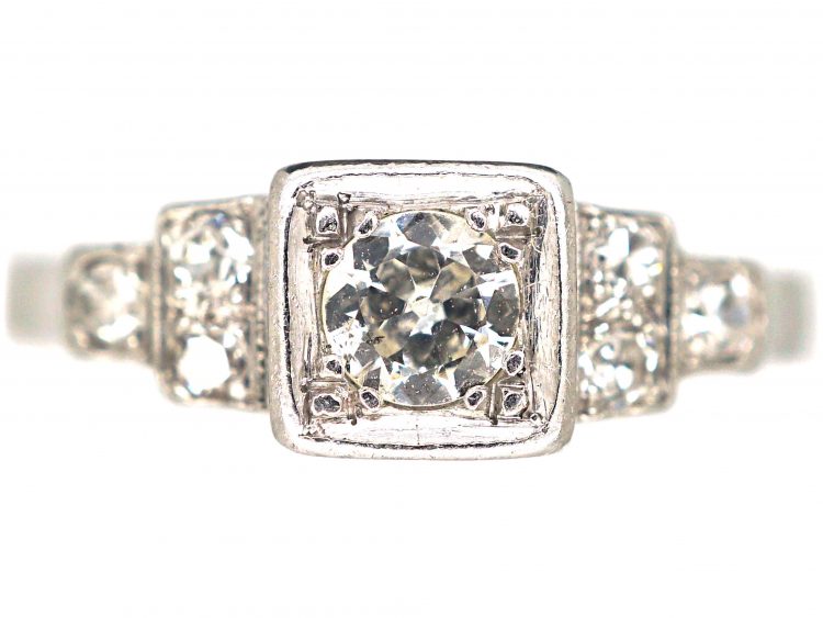 Art Deco Platinum, Diamond Solitaire Ring with Step Cut Shoulders set with Diamonds