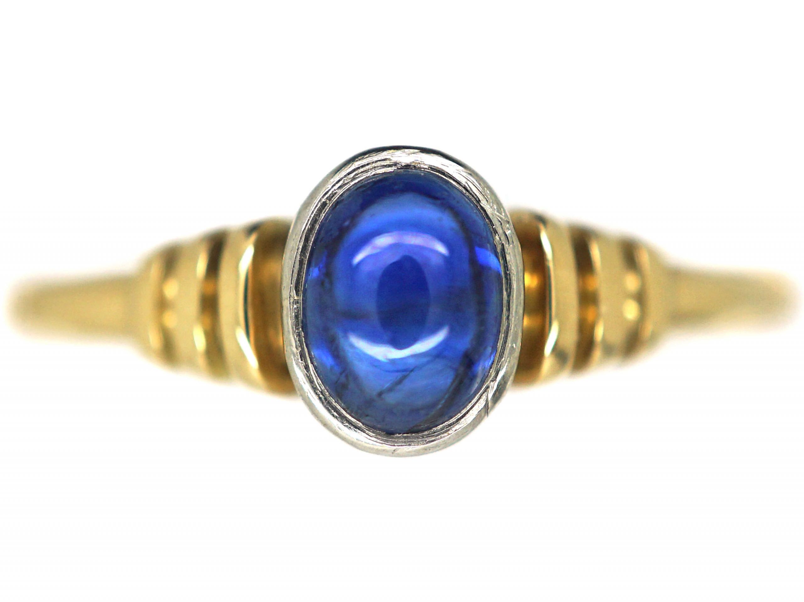Gold sapphire ring A 9K yellow gold 8 blue sapphire cabachon ring.