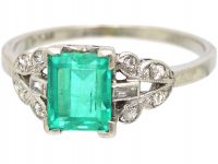 Art Deco Platinum, Rectangular Cut Emerald Ring with Diamond Set Shoulders