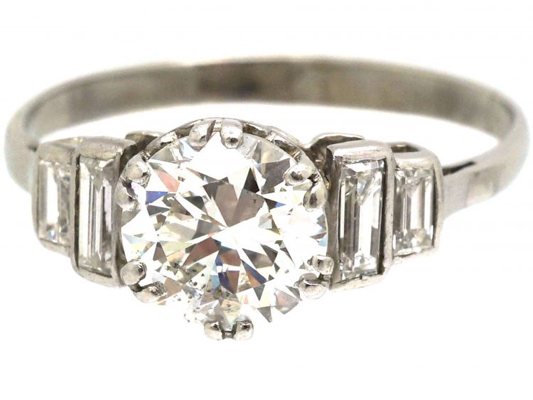 Art Deco Platinum, Diamond Solitaire Ring with Stepped Shoulders set with Baguette Diamonds