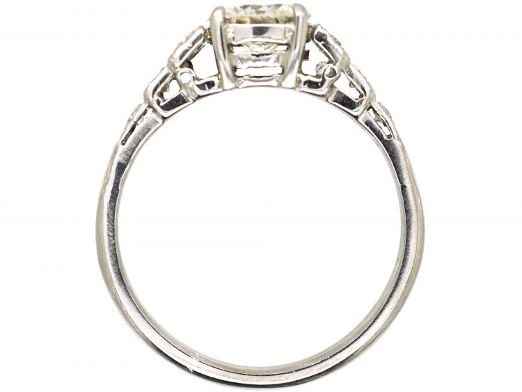 Art Deco Platinum Solitaire Diamond Ring with Step Cut Shoulders set with Diamonds