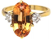 18ct Gold Ring set with a Topaz with Diamond Set Shoulders