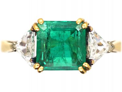 18ct Gold Ring set with an Emerald with a Triangular Cut Diamond on Either Side