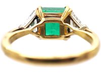 18ct Gold Ring set with an Emerald with a Triangular Cut Diamond on Either Side