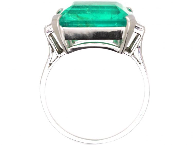 Art Deco Platinum Ring set with a Large Colombian Emerald with Diamond Baguette Shoulders
