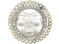 Edwardian Carved Moonstone Man in the Moon Brooch with a Border of Natural Pearls & Diamonds