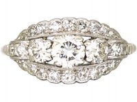 Early 20th Century Platinum, Three Stone Diamond Cluster Ring by Alabaster & Wilson