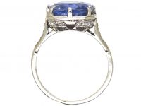 Early 20th Century Platinum Ring set with a Large Sapphire with Diamond Detail
