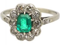 Edwardian Platinum Cluster Ring set with an Emerald & Diamonds