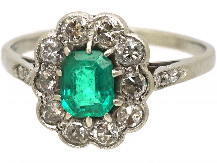 Edwardian Platinum Cluster Ring set with an Emerald & Diamonds