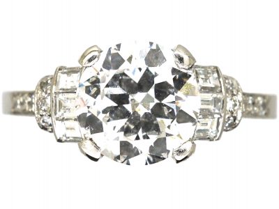 Art Deco Platinum, Diamond Solitaire Ring with Baguette & Round Diamond set Shoulders