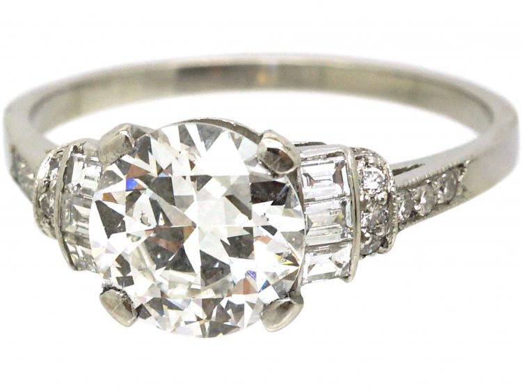 Art Deco Platinum, Diamond Solitaire Ring with Baguette & Round Diamond set Shoulders