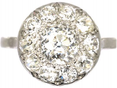 Early 20th Century Platinum Bombè Diamond Cluster Ring