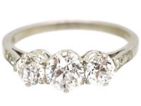 Early 20th Century Platinum, Three Stone Diamond Ring with Diamond Set Shoulders