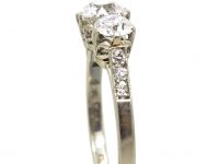 Early 20th Century Platinum, Three Stone Diamond Ring with Diamond Set Shoulders