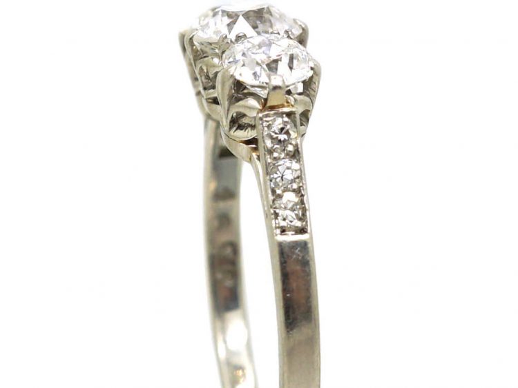 Early 20th Century Platinum, Three Stone Diamond Ring with Diamond Set Shoulders