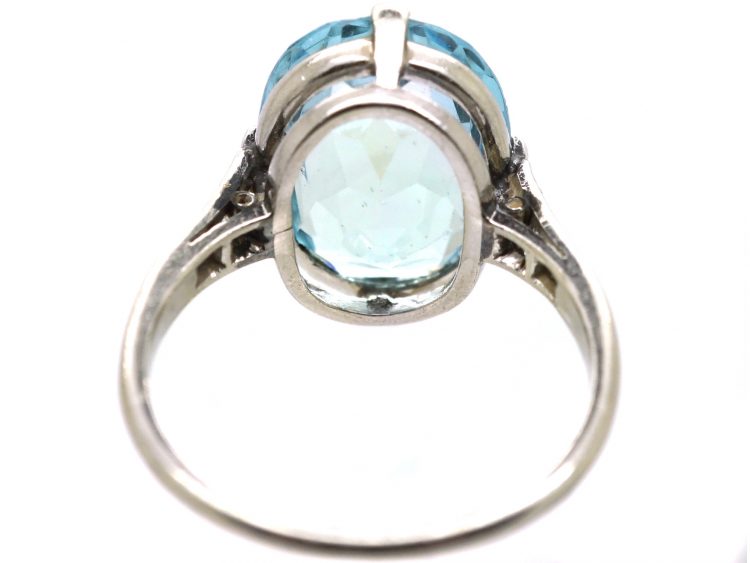 Early 20th Century Platinum Ring set with an Aquamarine with Diamond Set Shoulders