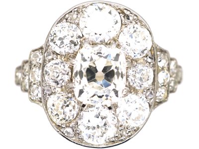 Early 20th Century Large 18ct White Gold Large Oval Diamond Cluster Ring with Diamond Set Step Cut Shoulders