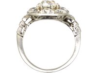 Early 20th Century Large 18ct White Gold Large Oval Diamond Cluster Ring with Diamond Set Step Cut Shoulders