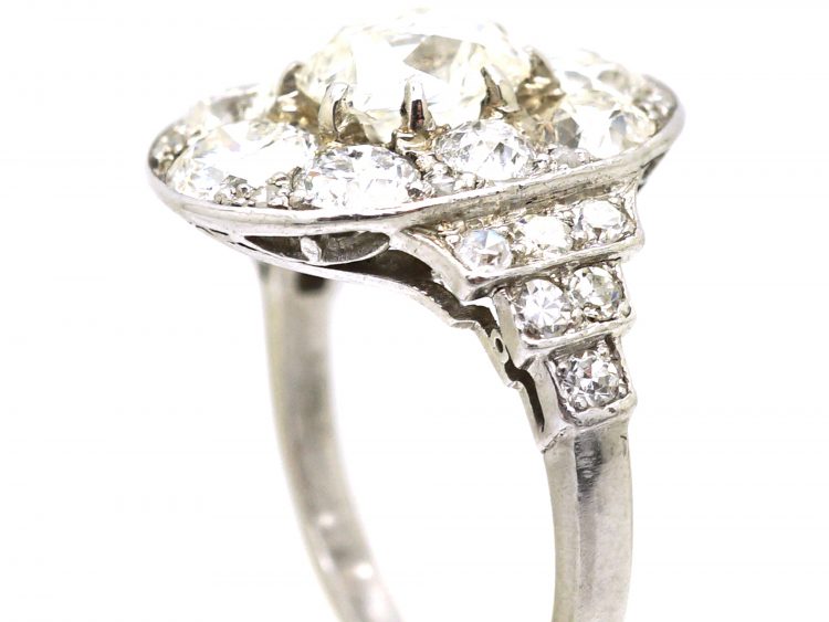 Early 20th Century Large 18ct White Gold Large Oval Diamond Cluster Ring with Diamond Set Step Cut Shoulders