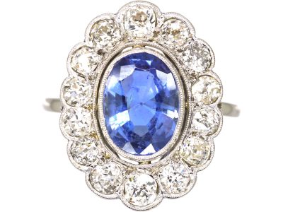 Early 20th Century Platinum, Large Sapphire & Diamond Oval Cluster Ring