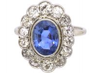 Early 20th Century Platinum, Large Sapphire & Diamond Oval Cluster Ring