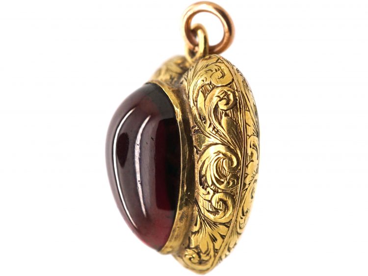 Victorian 15ct Gold Heart Shaped Pendant set with a Cabochon Cut Garnet