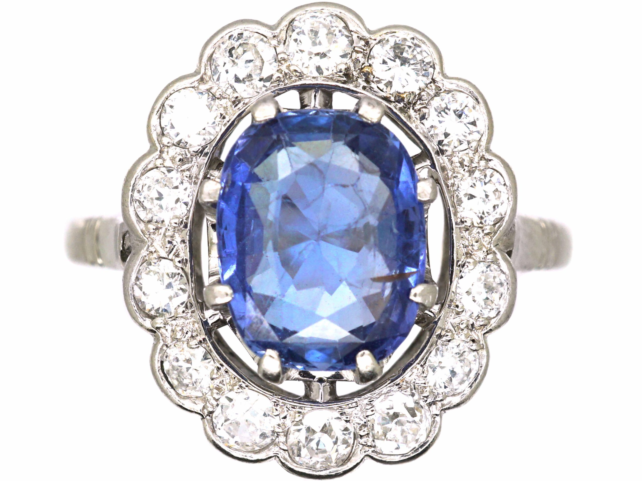 Early 20th Century French Import Platinum Large Cluster Ring set with a Sapphire & Diamonds