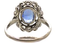 Early 20th Century French Import Platinum Large Cluster Ring set with a Sapphire & Diamonds