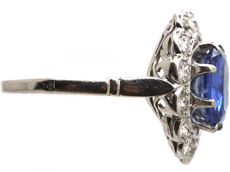Early 20th Century French Import Platinum Large Cluster Ring set with a Sapphire & Diamonds