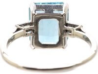 Retro Platinum Ring set with a Rectangular Cut Aquamarine with Baguette Cut Diamond Shoulderss
