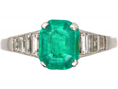 Art Deco 18ct White Gold Ring set with an Emerald with Step Cut Diamond Shoulders