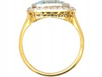 Edwardian 18ct Gold & Platinum Ring set with an Aquamarine with a Diamond Border