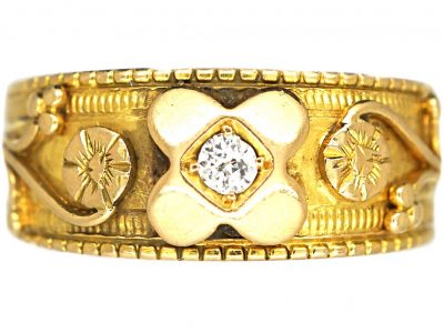 Edwardian 18ct Gold Ring with Flower Motifs and set with a Diamond