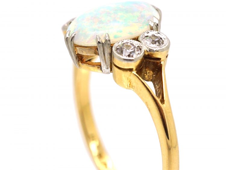 Edwardian 18ct Gold & Platinum Ring set with an Opal with Diamonds on Either Side
