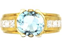 18ct Gold Modernist Ring set with an Aquamarine with Princess Cut Diamond Shoulders