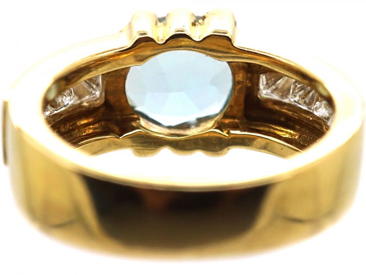 18ct Gold Modernist Ring set with an Aquamarine with Princess Cut Diamond Shoulders