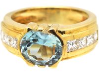 18ct Gold Modernist Ring set with an Aquamarine with Princess Cut Diamond Shoulders