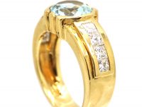 18ct Gold Modernist Ring set with an Aquamarine with Princess Cut Diamond Shoulders